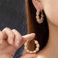 Diamond cut wavy coil hoop earrings