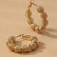 Diamond cut wavy coil hoop earrings